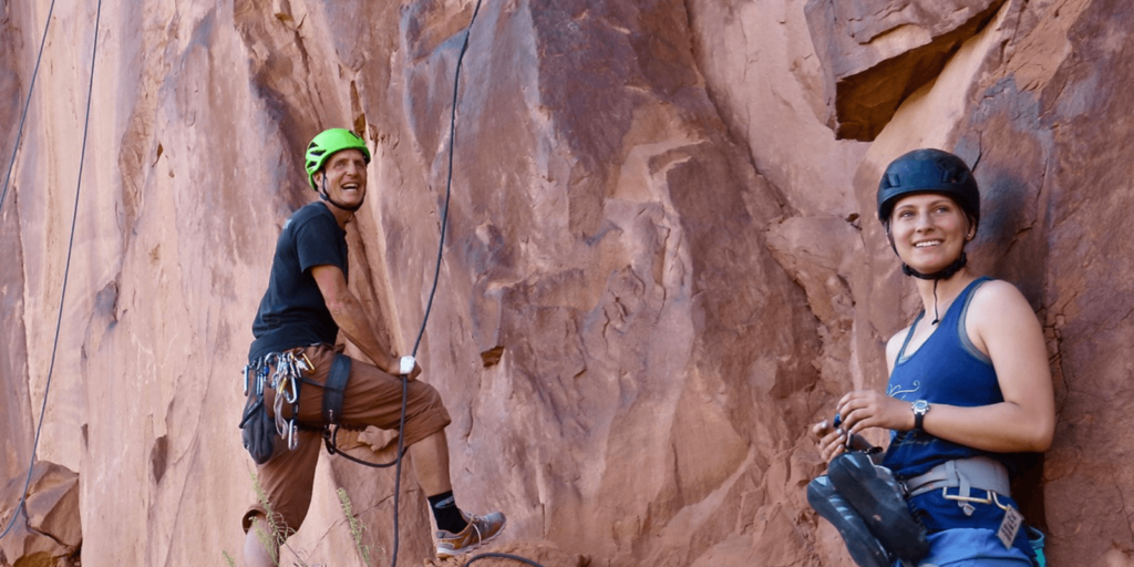 Two people preparing to rock climb