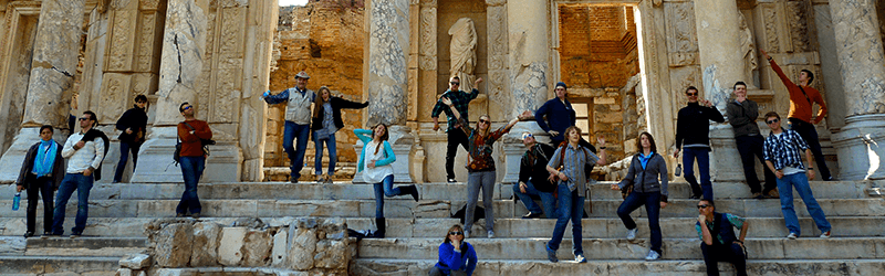 A group standing in front of an ancient building